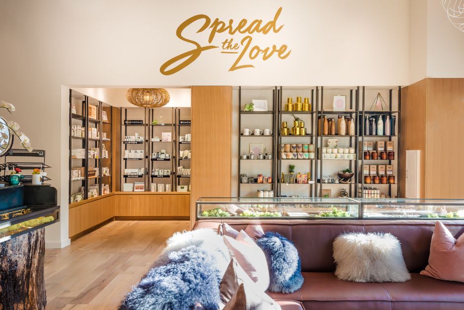 Lobby of Viva Day Spa + Med Spa Domain Northside with mural that reads "Spread The Love."